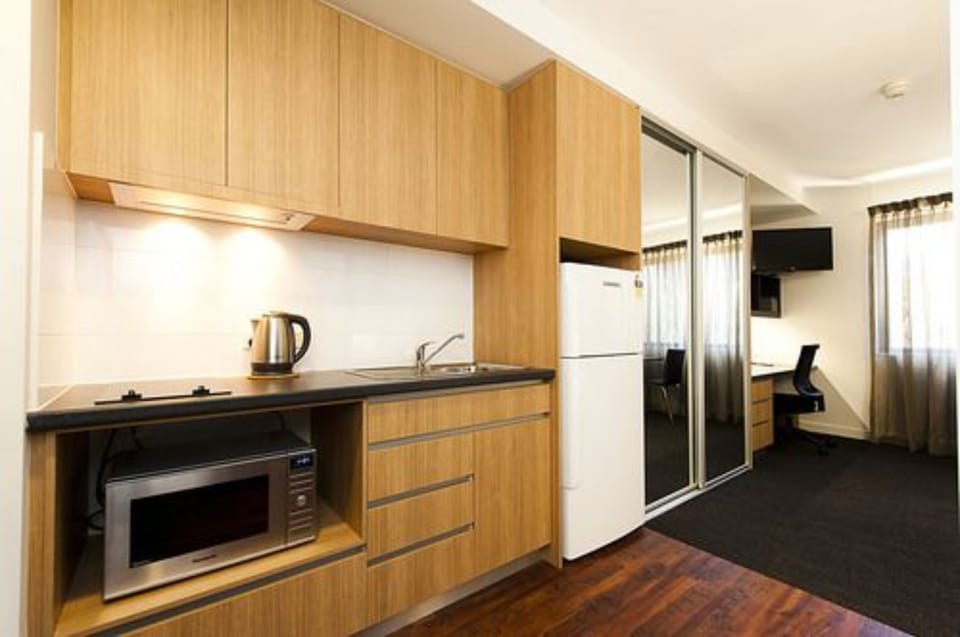 Executive Studio | Private kitchen | Full-size fridge, microwave, stovetop, coffee/tea maker