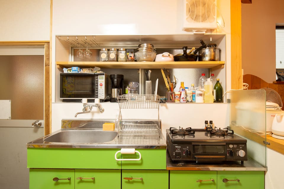 Mini-fridge, stovetop, cookware/dishes/utensils