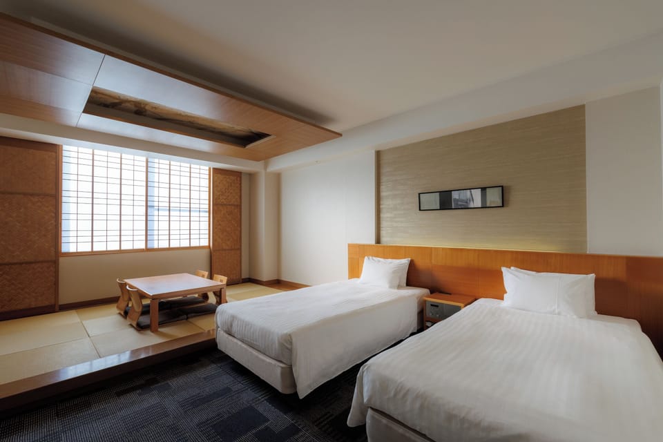 Deluxe Twin Room with Extra Japanese Futon, Non-Smoking | In-room safe, desk, iron/ironing board (on request), cribs (free)