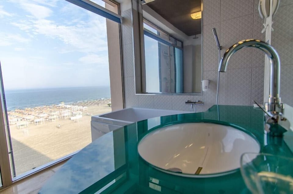 Designer toiletries, hair dryer, bathrobes, slippers