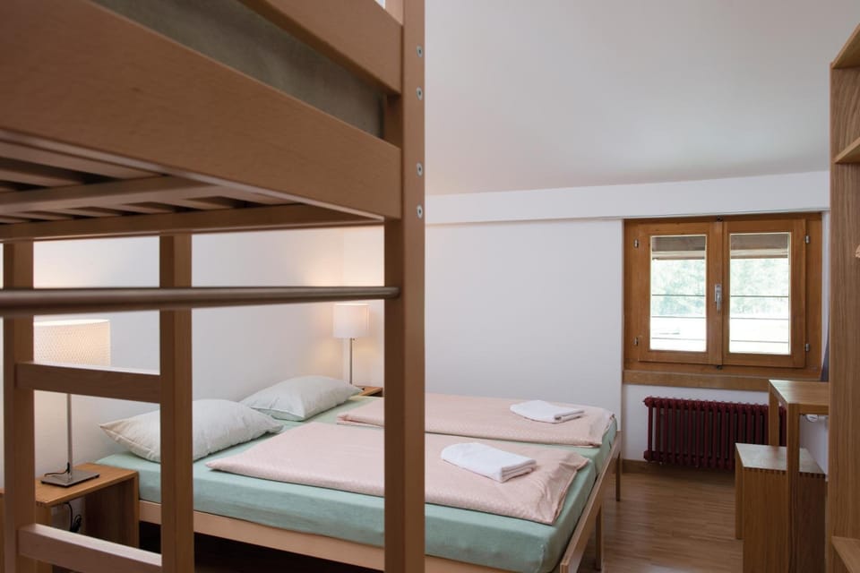 Quadruple Room, Shared Bathroom | In-room safe, desk, bed sheets