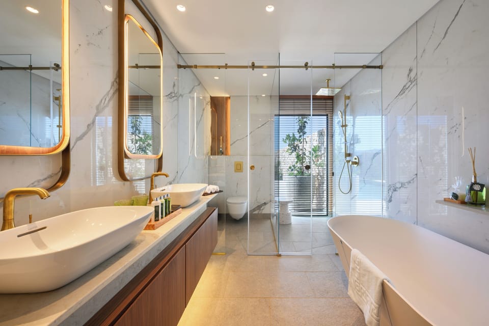 Designer toiletries, hair dryer, bathrobes, slippers