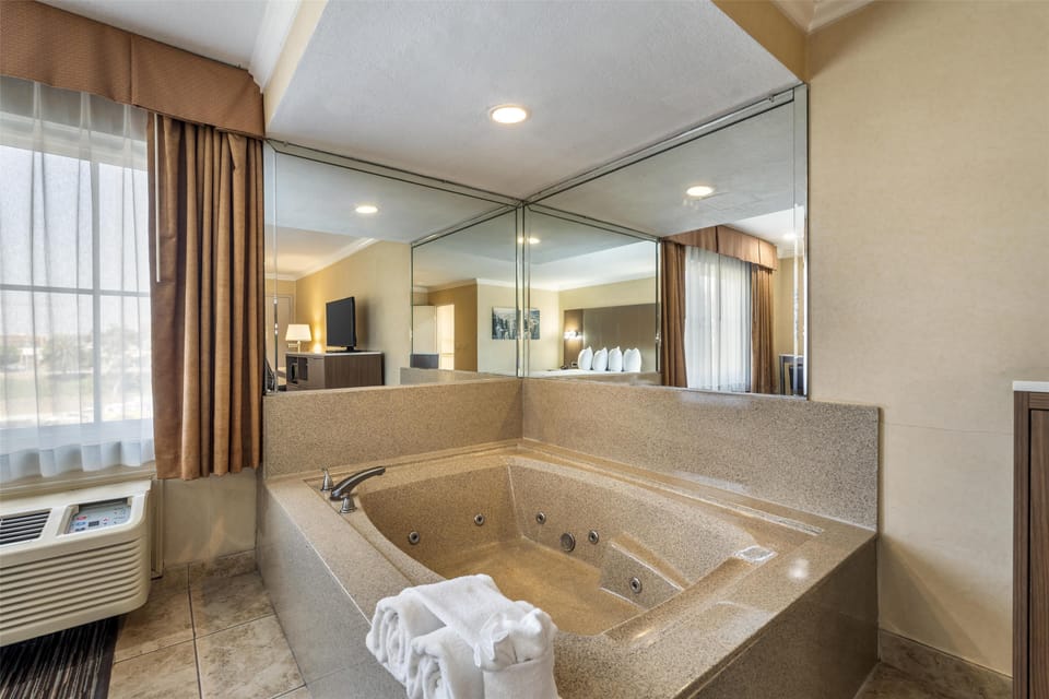 Suite, 1 King Bed, Non Smoking, Jetted Tub | In-room safe, desk, laptop workspace, iron/ironing board