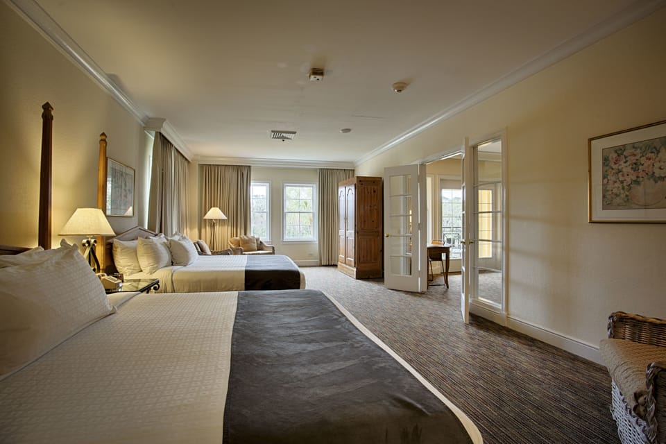 Deluxe Suite, 2 Queen Beds | Individually furnished, iron/ironing board, WiFi, bed sheets