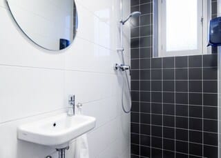 Basic - Comfort Room | Bathroom | Hair dryer, towels, soap, shampoo