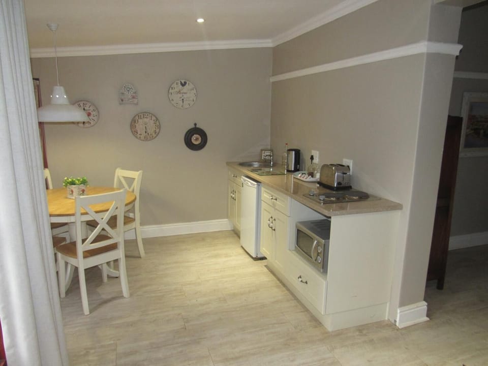 Fridge, stovetop, electric kettle, cookware/dishes/utensils