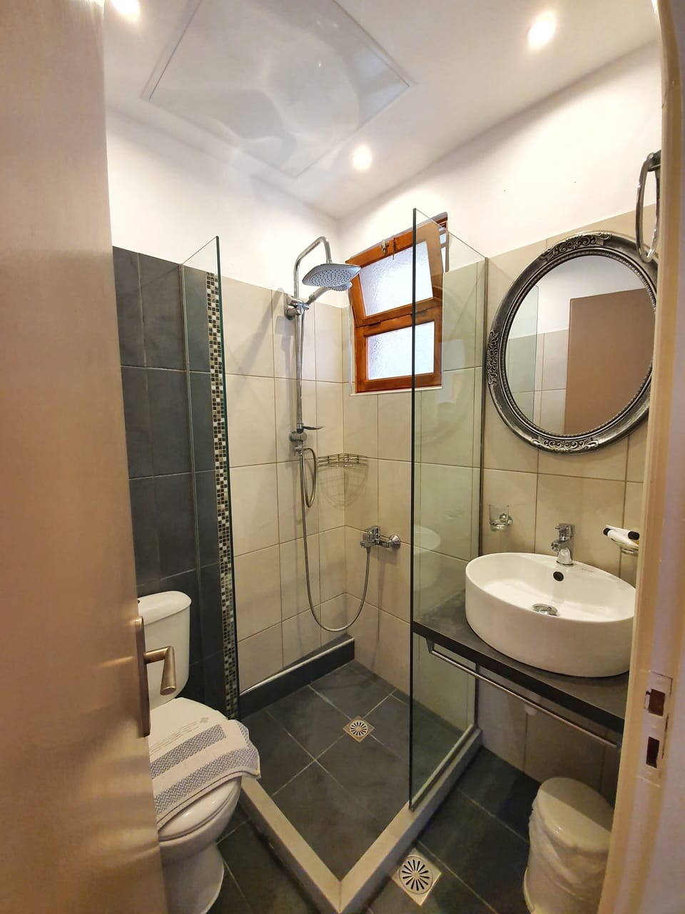 Shower, free toiletries, hair dryer, slippers