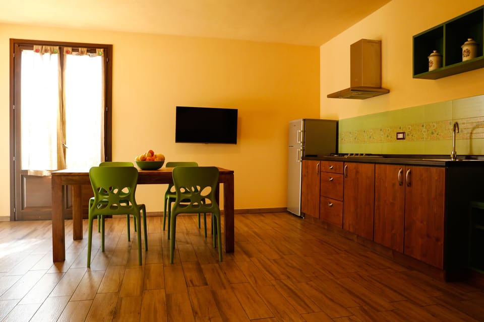 Apartment, 1 Bedroom, Patio, Garden View | Living area | Flat-screen TV