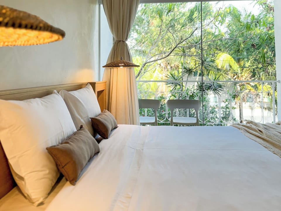 Deluxe Twin Room, Patio | Minibar, laptop workspace, blackout drapes, iron/ironing board