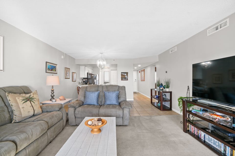 Condo, 2 Bedrooms, Sea View (904) | Living area | 40-inch flat-screen TV with cable channels, TV, DVD player
