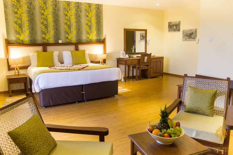 Cottage, Garden View | Minibar, in-room safe, individually furnished, desk