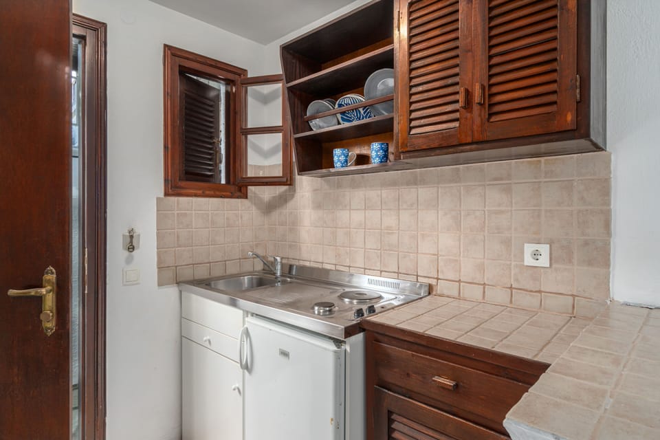 Studio (Garden View) | Private kitchen | Mini-fridge, electric kettle, cleaning supplies, paper towels