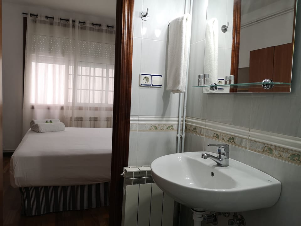 Double Room | Bathroom | Shower, hair dryer, towels, soap