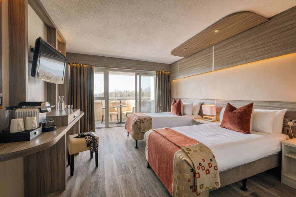 Twin Room with Balcony | Laptop workspace, WiFi (free), bed sheets