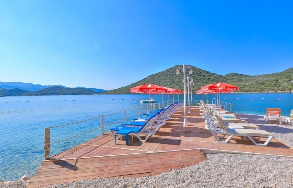 On the beach, sun loungers, beach umbrellas, snorkeling