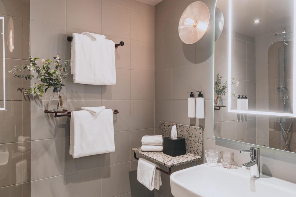 Designer toiletries, hair dryer, towels, soap