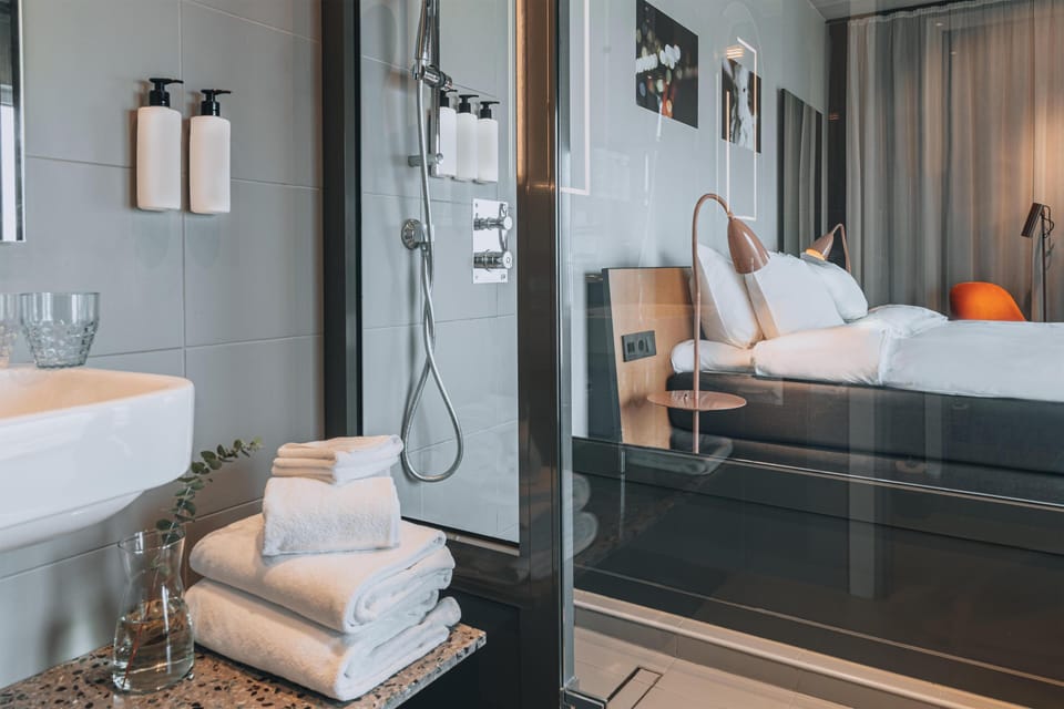 Deluxe Room, 1 King Bed, Ocean View | Bathroom | Designer toiletries, hair dryer, towels, soap