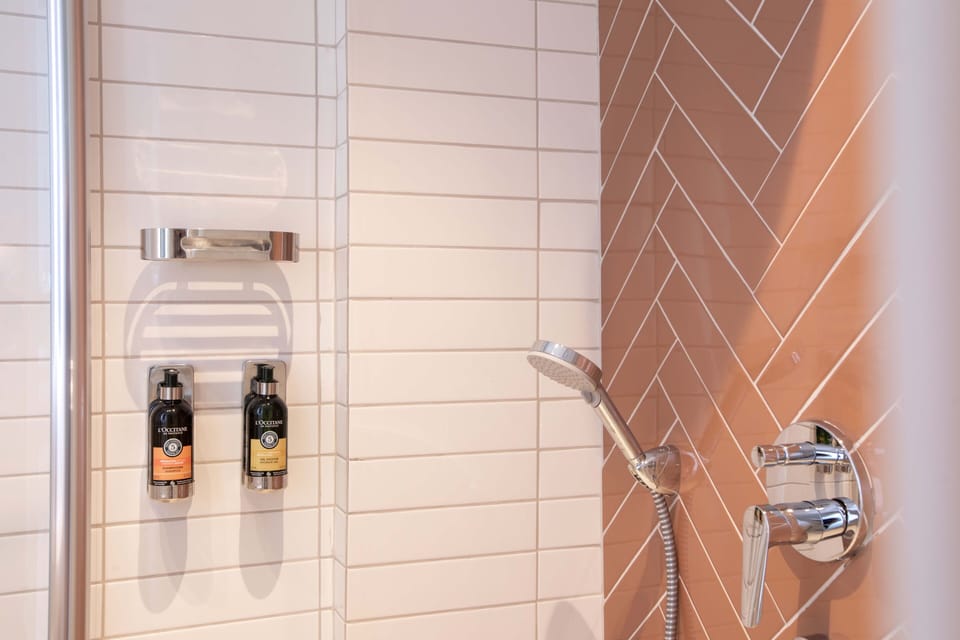 Shower, eco-friendly toiletries, hair dryer, slippers