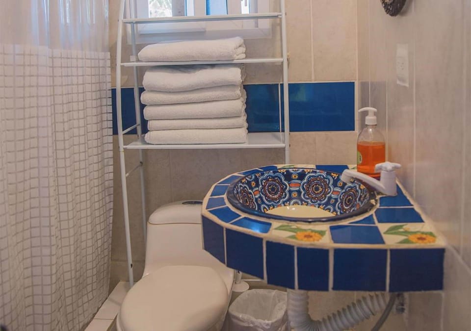 Quadruple Room with Sea View | Bathroom | Shower, designer toiletries, towels, soap
