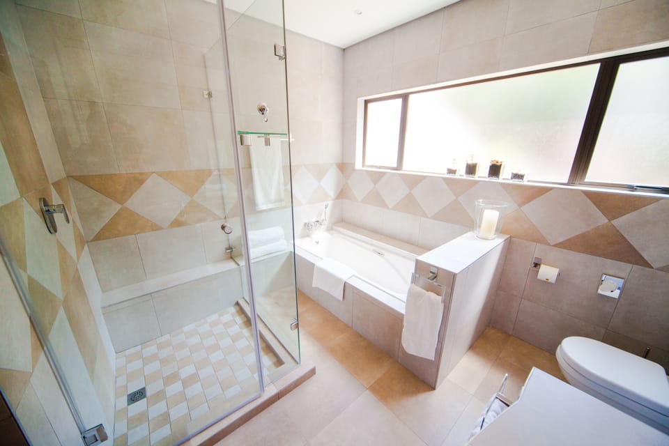 Separate tub and shower, free toiletries, hair dryer, slippers