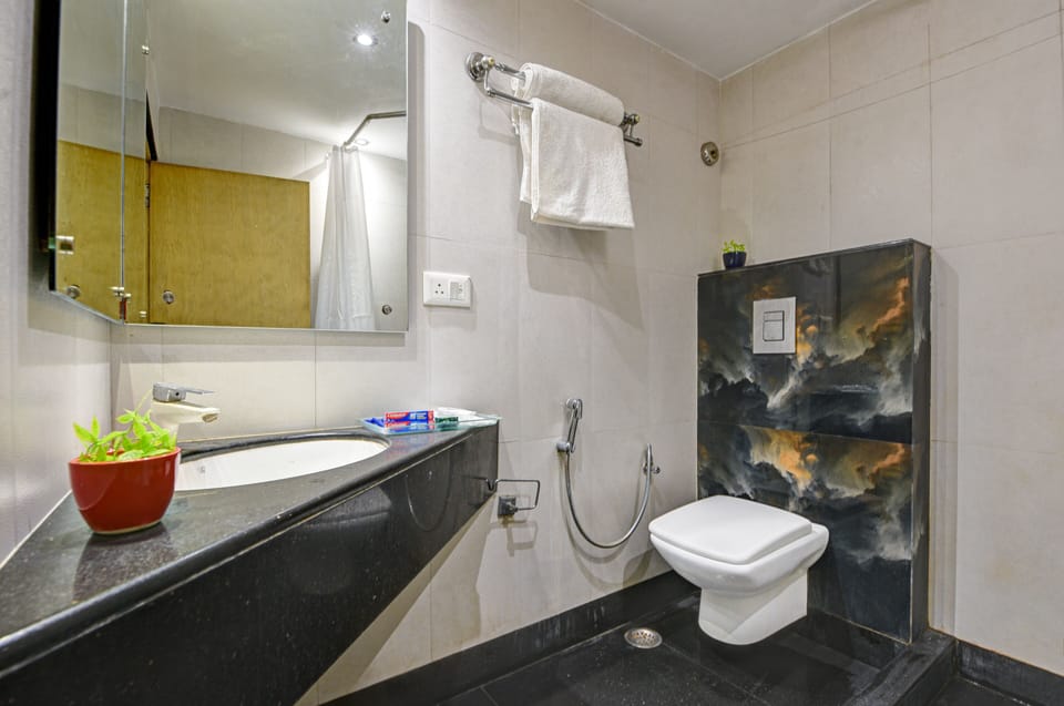 Shower, rainfall showerhead, eco-friendly toiletries, slippers