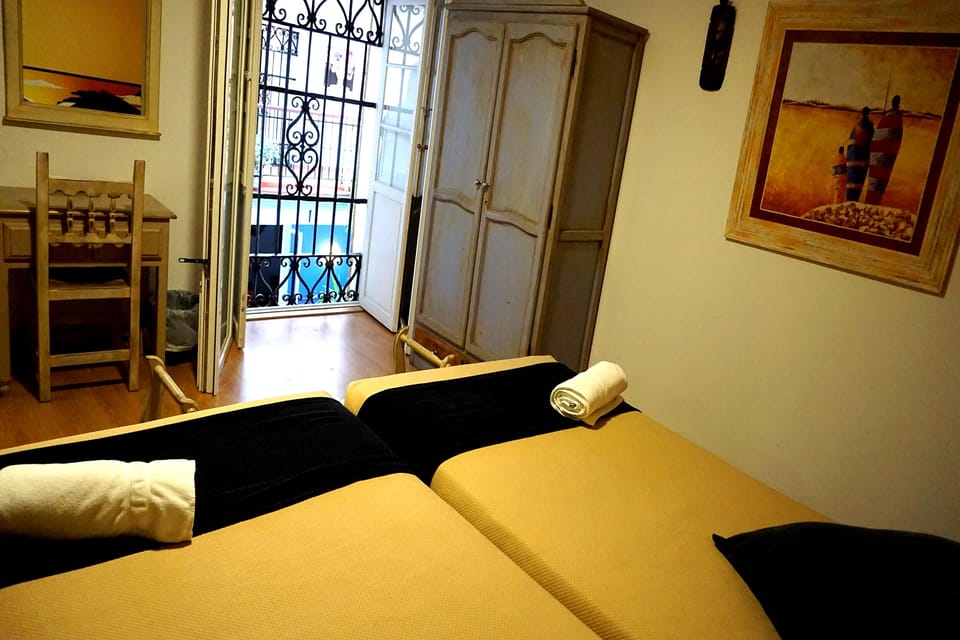 Economy Double Room, Private Bathroom | Minibar, individually decorated, desk, laptop workspace
