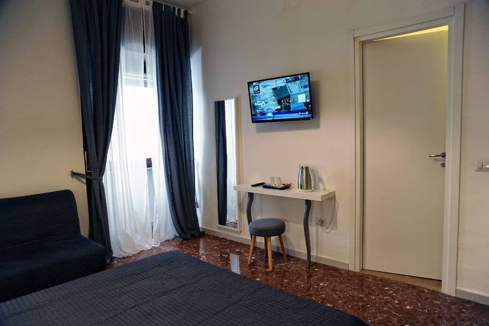 Economy Double Room | 1 bedroom, minibar, desk, blackout drapes