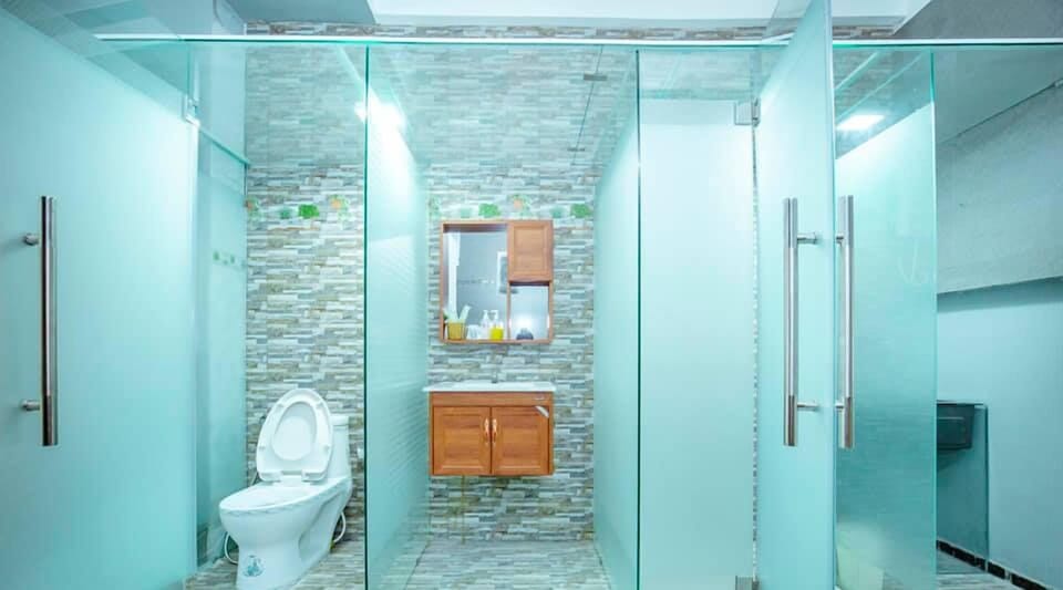 Twin Room, 2 Double Beds | Bathroom | Shower, free toiletries, slippers, towels