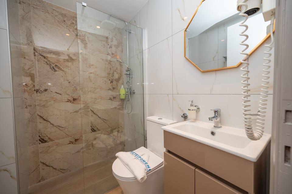 Shower, free toiletries, hair dryer, slippers