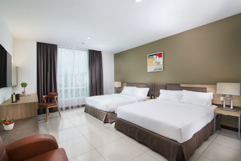 Family Quadruple Room, 2 Queen Beds | In-room safe, desk, laptop workspace, blackout drapes