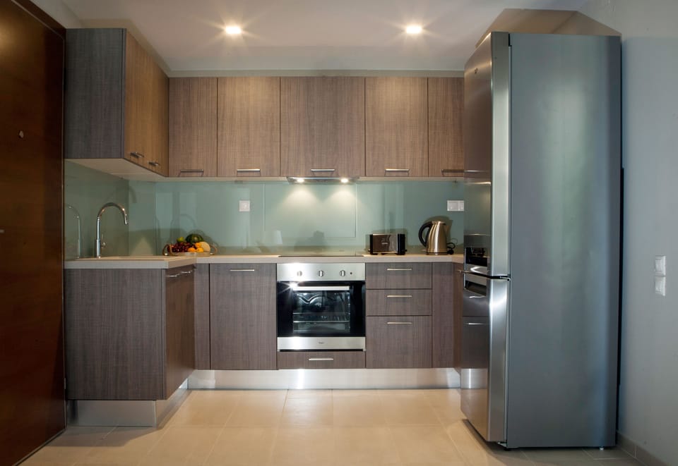 Apartment, 1 Bedroom, Partial Sea View | Private kitchen | Coffee/tea maker, oven, stovetop, electric kettle