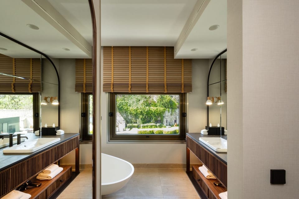 Designer toiletries, hair dryer, bathrobes, slippers