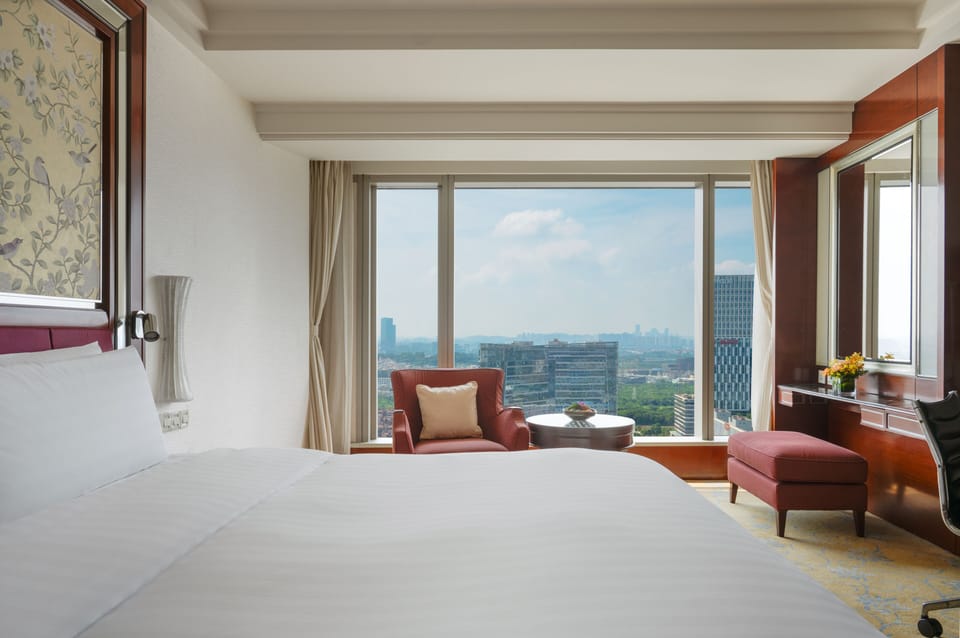 Premium bedding, down comforters, free minibar items, in-room safe