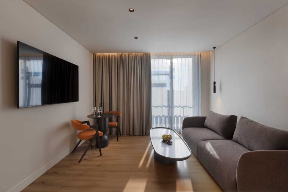 Family Room, Multiple Beds | Living area | Flat-screen TV