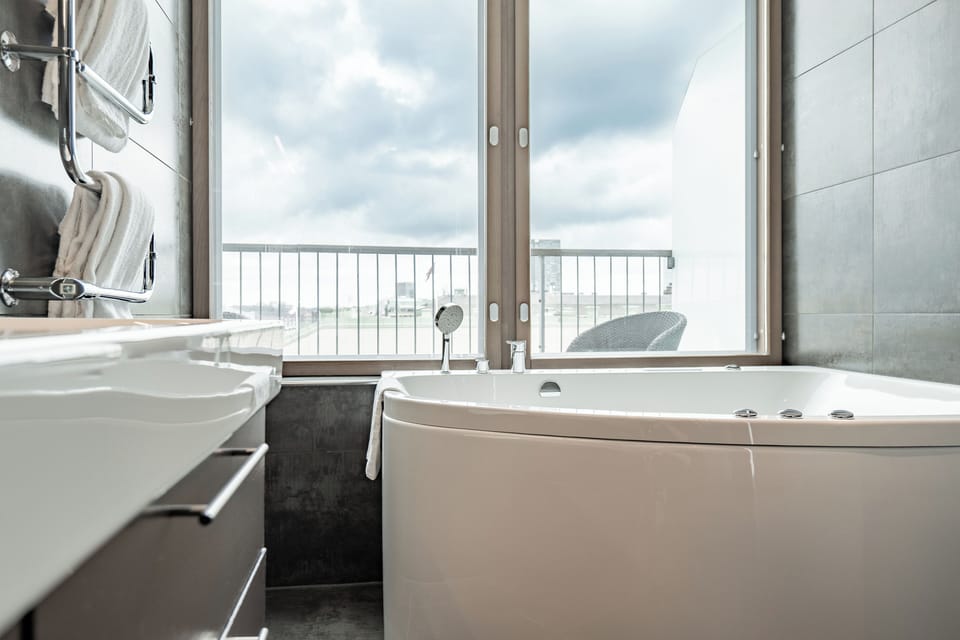 Premium Suite | Bathroom | Shower, rainfall showerhead, eco-friendly toiletries, hair dryer