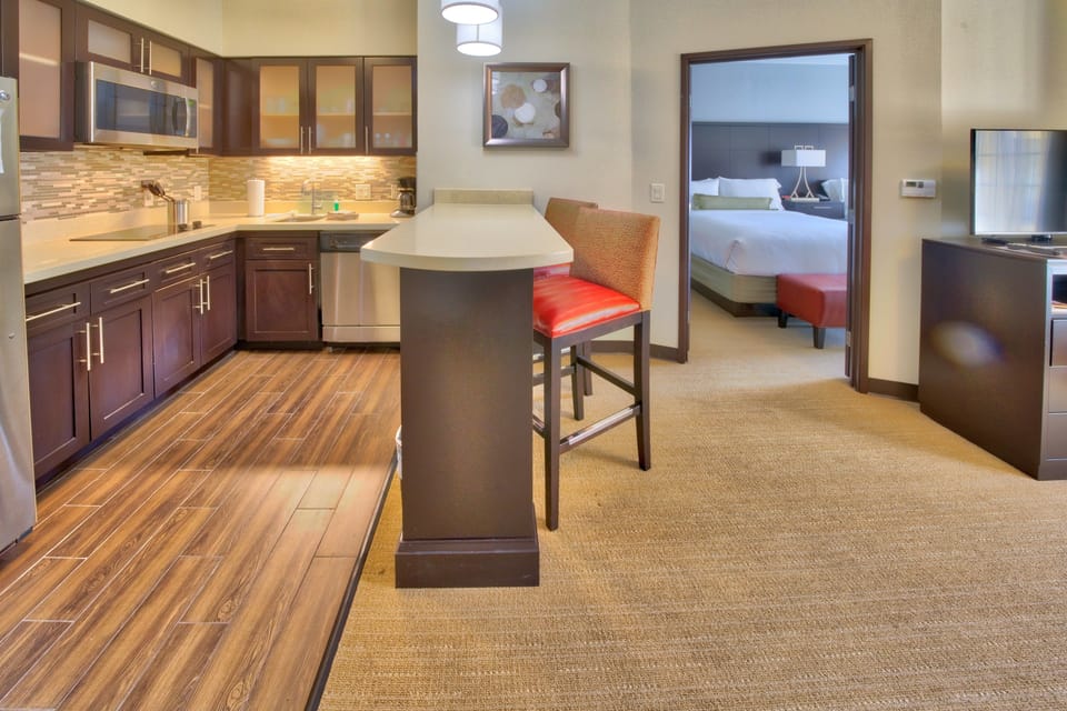 Desk, iron/ironing board, cribs (free), WiFi (free)