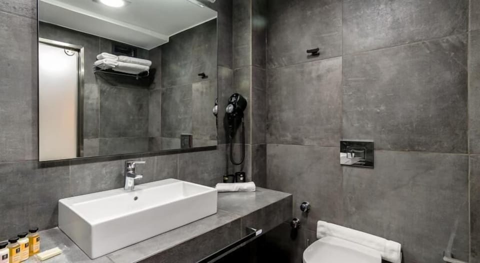 Shower, designer toiletries, hair dryer, bathrobes