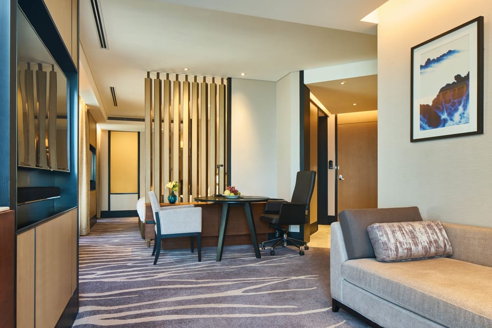 1 King Junior Suite | Living area | 48-inch LCD TV with cable channels, TV, MP3 dock
