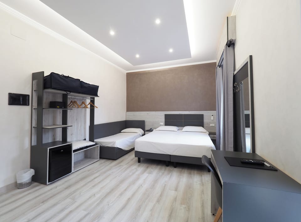 Triple Room | Hypo-allergenic bedding, minibar, in-room safe, desk