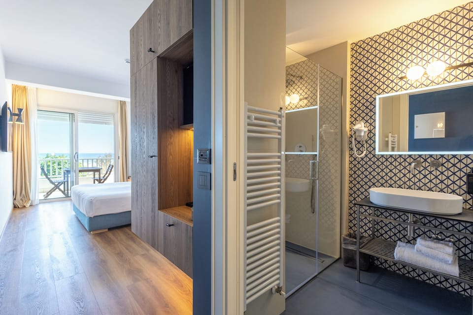 Superior Double Room, Sea View | Down comforters, minibar, in-room safe, desk