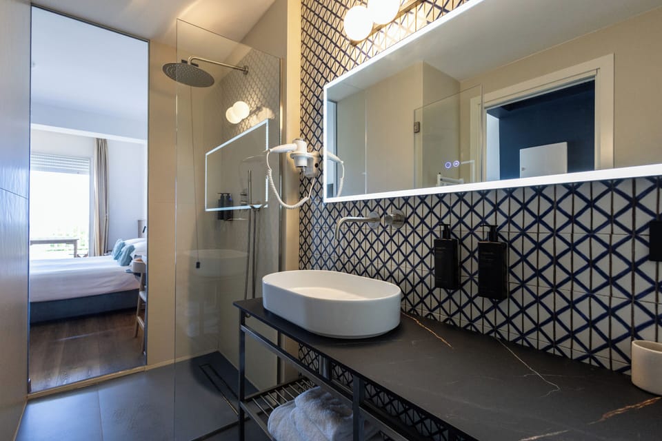 Superior Double Room, Sea View | Down comforters, minibar, in-room safe, desk