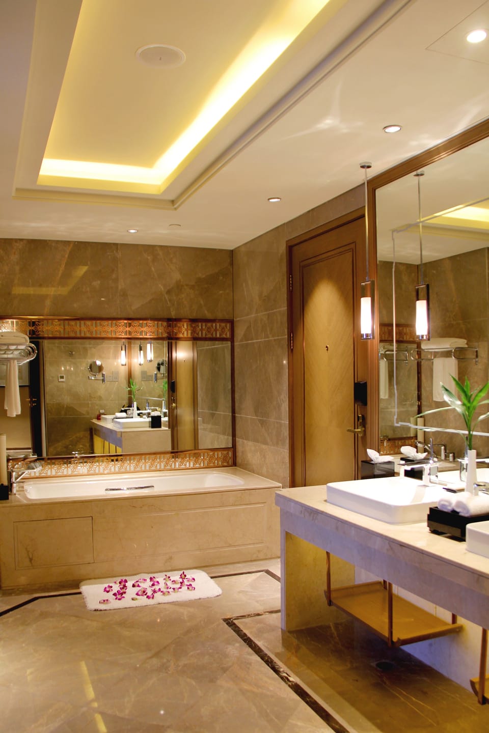 Deluxe Suite, City View | Bathroom | Separate tub and shower, rainfall showerhead, hair dryer, bathrobes