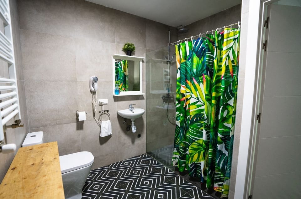 Separate tub and shower, rainfall showerhead, free toiletries, towels