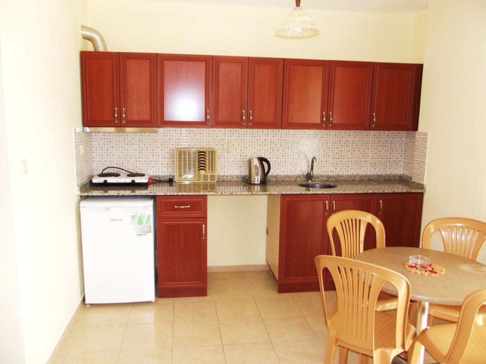Standard Apartment, Pool View | Private kitchenette | Fridge, stovetop, electric kettle, toaster