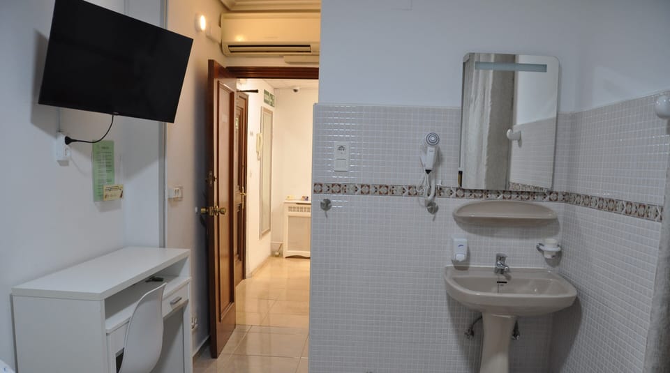 Twin room with private sink | Down comforters, Select Comfort beds, desk, laptop workspace