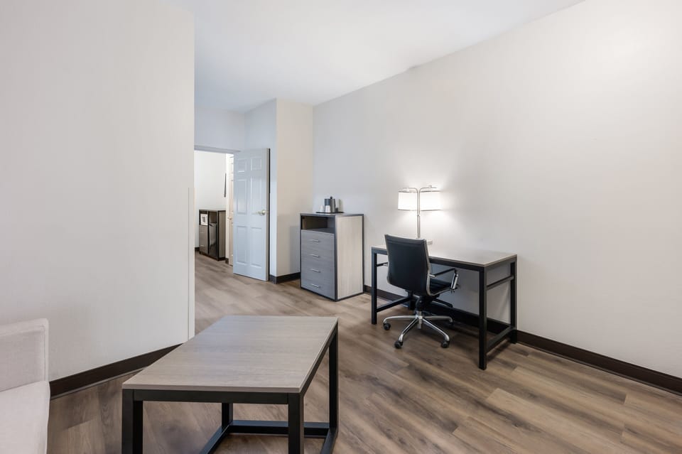 Suite, 1 King Bed (2 Rooms, Smoke Free) | Desk, laptop workspace, blackout drapes, iron/ironing board