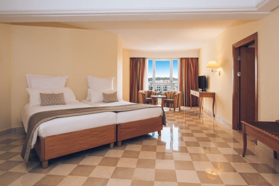 Family Room, Garden View | Minibar, in-room safe, individually decorated, individually furnished