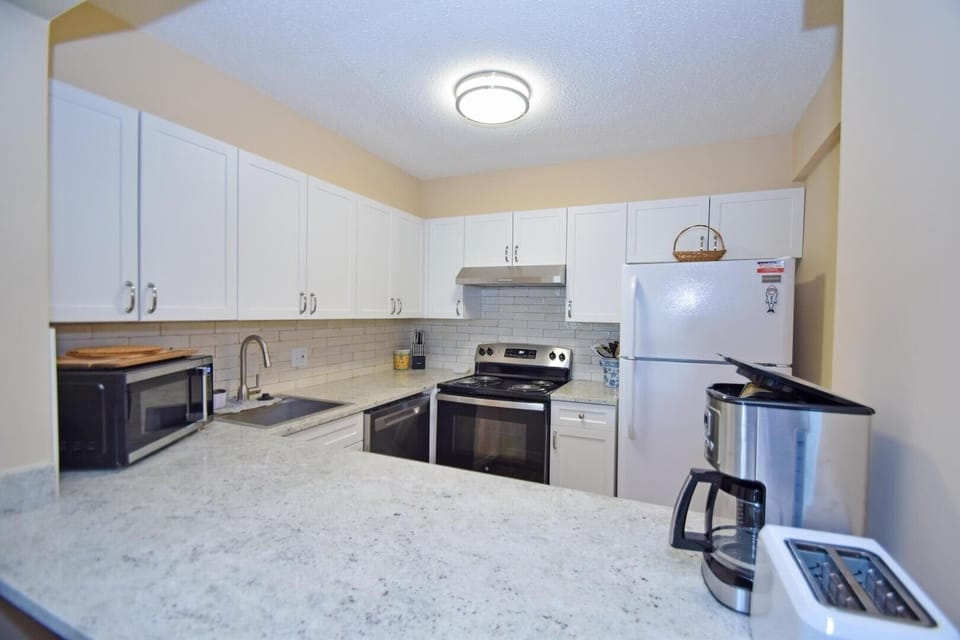Condo, 2 Bedrooms | Private kitchen | Full-size fridge, microwave, stovetop, dishwasher