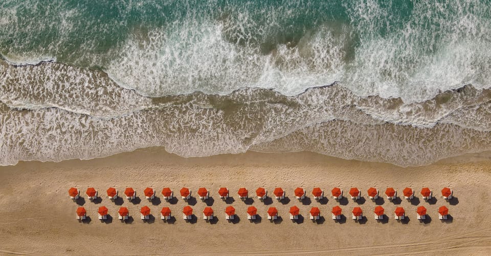 On the beach, sun loungers, beach umbrellas, beach towels