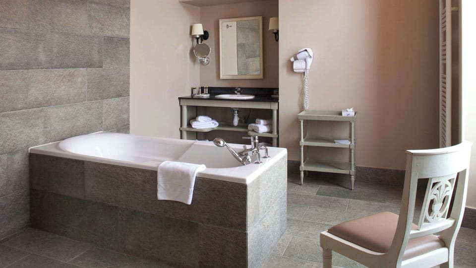 Suite, 1 Double Bed, Golf View | Bathroom | Hair dryer, towels